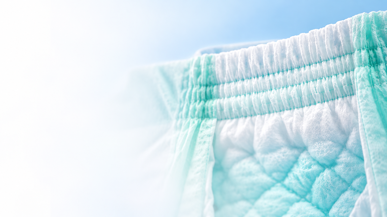 Close-up of the elastic gathered waistband on an HB Hammiko baby diaper